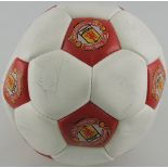 A Manchester United official football, signed by players.