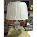 A pair of bohemian style vase shaped glass tablelamps with pleated ivory shades.