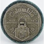 An early 20th Century Columbia Records patent record cleaner with circular plush pad, Dia. 8cm.