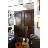 A pair of late 18th/early 19th Century French provincial oak armoire doors of twin panel