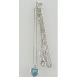 A blue topaz pendant with single diamond accent, in 18ct white gold, with a 9ct white gold chain, L.