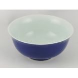 A Chinese blue bowl, with everted lip and white glazed interior, on a foot rim, D. 13cm.