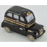 A limoges novelty porcelain box modelled as a London taxi.