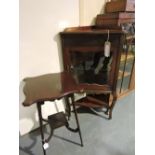 A Victorian glazed mahogany standing corner cabinet together with an Edwardian occasional table.