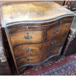 Small serpentine front walnut chest of drawers, with two smaller drawers over two larger,