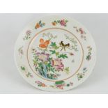 A 19th century famile rose plate, decorated with a bird among flowers,