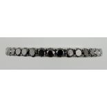 A half eternity ring, set with 20 black diamonds in an 18ct white gold band, size K, 2.2.