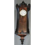 An early 20th century Vienna regulator style wall clock, with walnut and ebonised case,