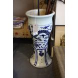 A Chinese blue and white pottery standing jardiniere decorated with dragons and panels of