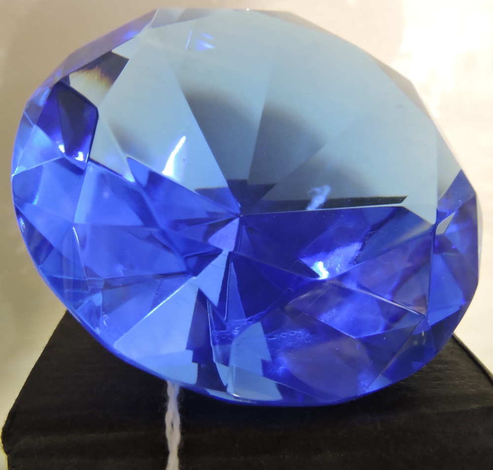 A large faceted glass faux sapphire.