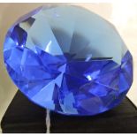 A large faceted glass faux sapphire.