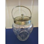 An Edwardian plate mounted cut glass biscuit barrel.