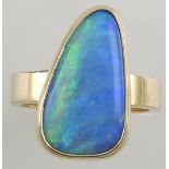 An opal dress ring, set in a yellow metal band stamped 14k, 7.5g.