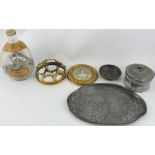 An oval pewter dish in the Art Nouveau decorated with a poppy, together with a lead tabaco jar,