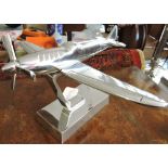 A chrome plated desk ornament modelled as a spitfire, H. 22cm.