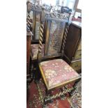 A set of four 1920s caned oak dining chairs on turned spiral legs.