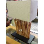 A designer twig tablelamp with rectangular shape on ebonised plinth base, H. 60cm.