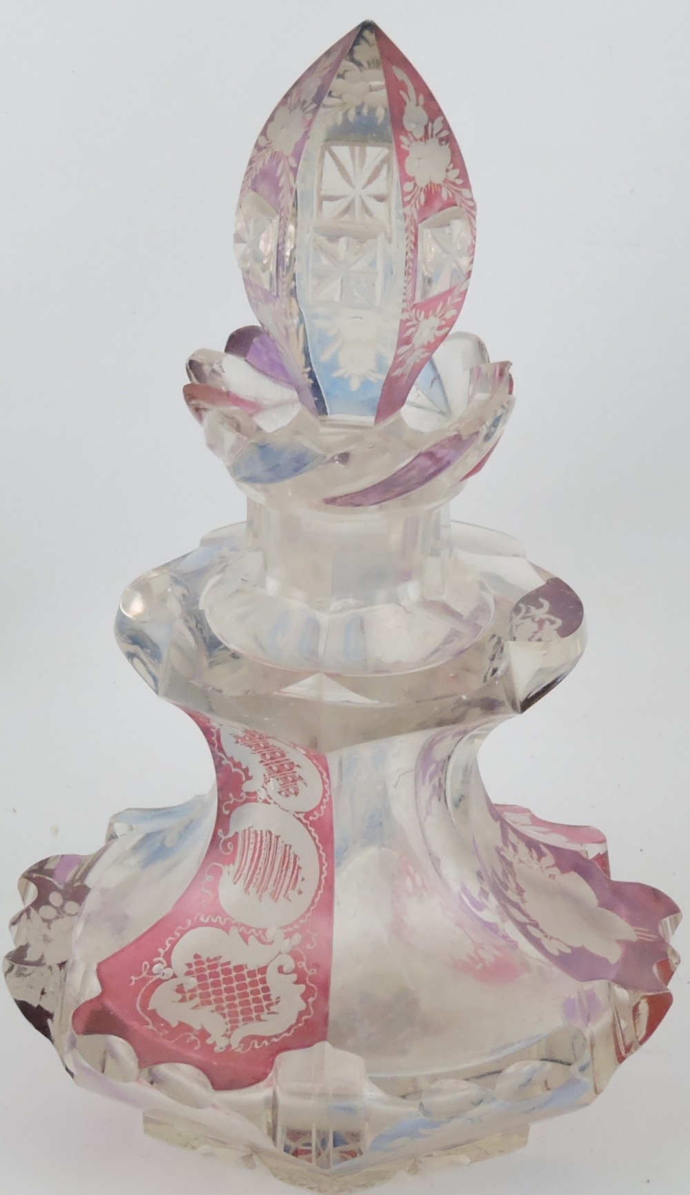 A late 19th century Bohemian clear glass bottle and stopper,