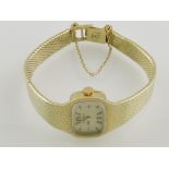 A Rolex ladies' wristwatch, with integral woven strap stamped 585,