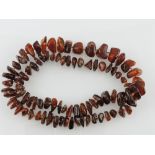 An amber necklace, comprising irregular graduated beads, L. 72cm.