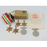 A group of six Second War medals comprising service medal and defence medal, Africa star,