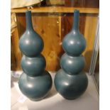 A pair of Chinese turquoise glazed triple gourd vases, H. 40cm.