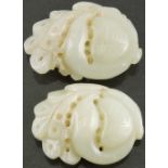 A pair of late 19th century Chinese nephrite hair jewels, carved as birds, H. 4cm.