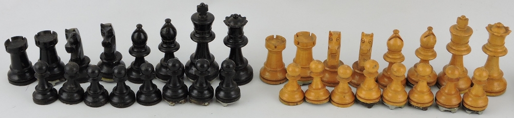 A Staunton chess set, turned boxwood with one side natural with the other eboinsed,