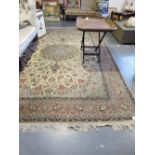 An Isphahan ivory ground carpet woven central lobed floral medallion within a scattered floral