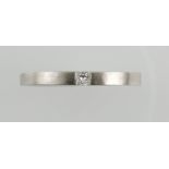 A platinum and diamond band, the square shaped diamond inset to a slightly tapered band, 4.3g.