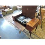 A vintage dynatron SRX 32 music centre in Queen Anne style walnut case.