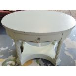 An oval pale green painted occasional table fitted drawer on fluted underframe.