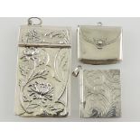 A silver stamp case in the form of an purse,