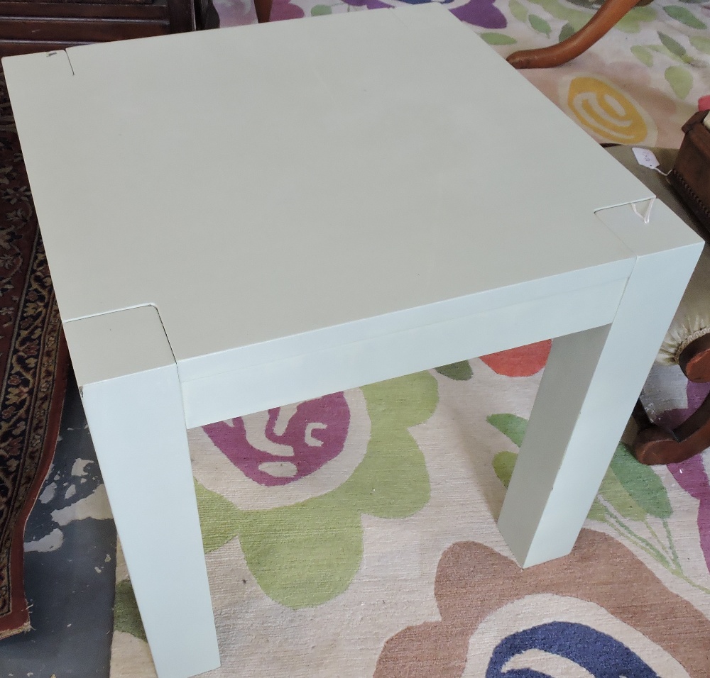 A square pale green painted lamp table.