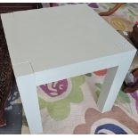 A square pale green painted lamp table.