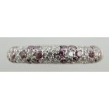 A white metal diamond dress ring, millegrain setting fancy coloured stones, 2g.