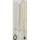 A green gemstone pendant, claw-set in a framed stamped 9ct, on a fine yellow metal chain,