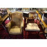 An Edwardian inlaid mahogany elbow chair together with a late Victorian armchair.