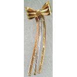 A bow brooch, with three colour articulated tassels, stamped 9ct, 1g.