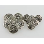 A set of 11 white metal golf club blazer buttons in two sizes decorated with crowned clubs and the