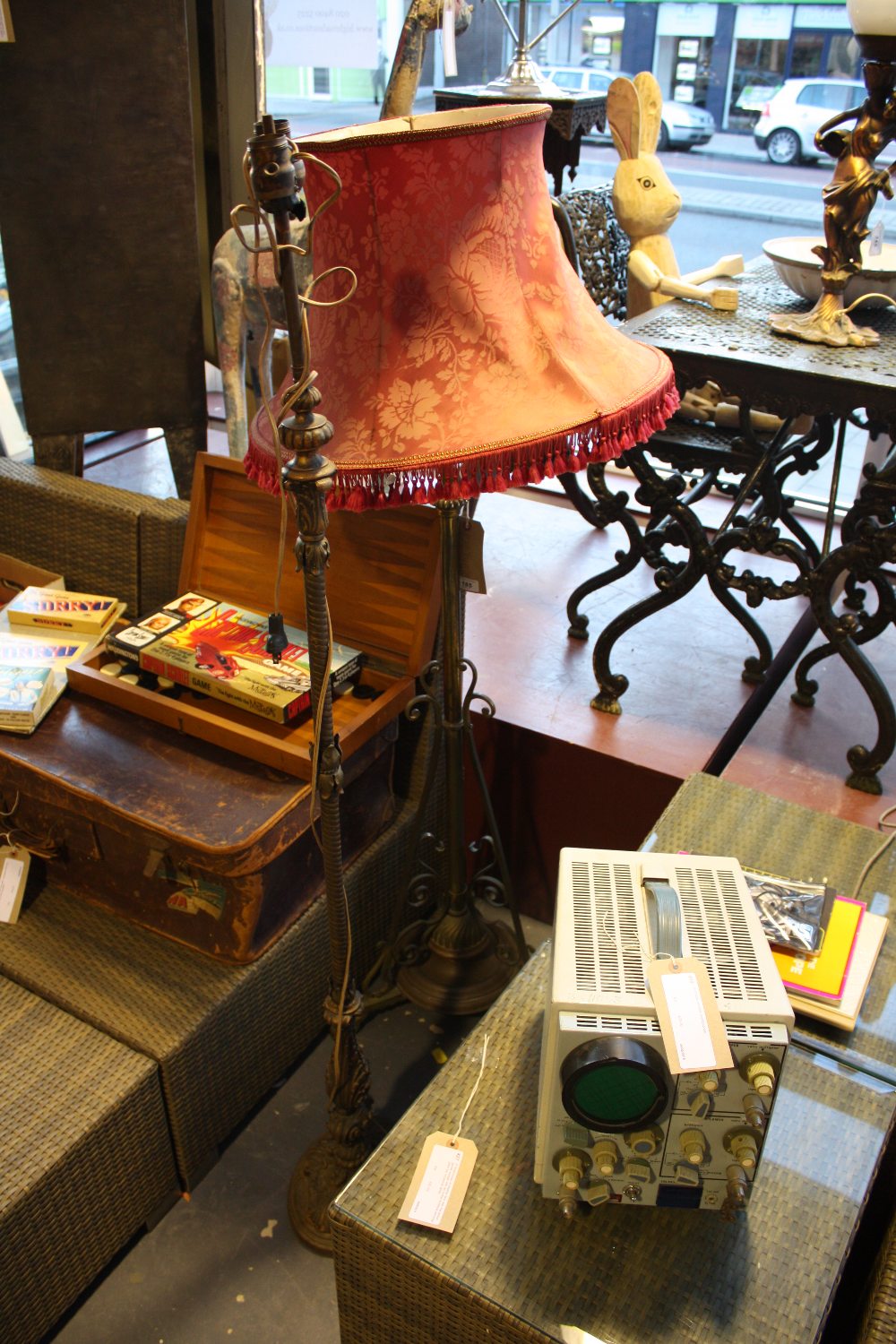 An early 20th Century brass standard lamp together with a later gilt metal standard lamp.