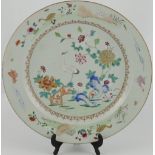 An early 19th Century Chinese famille rose porcelain charger decorated with a crane among flowering