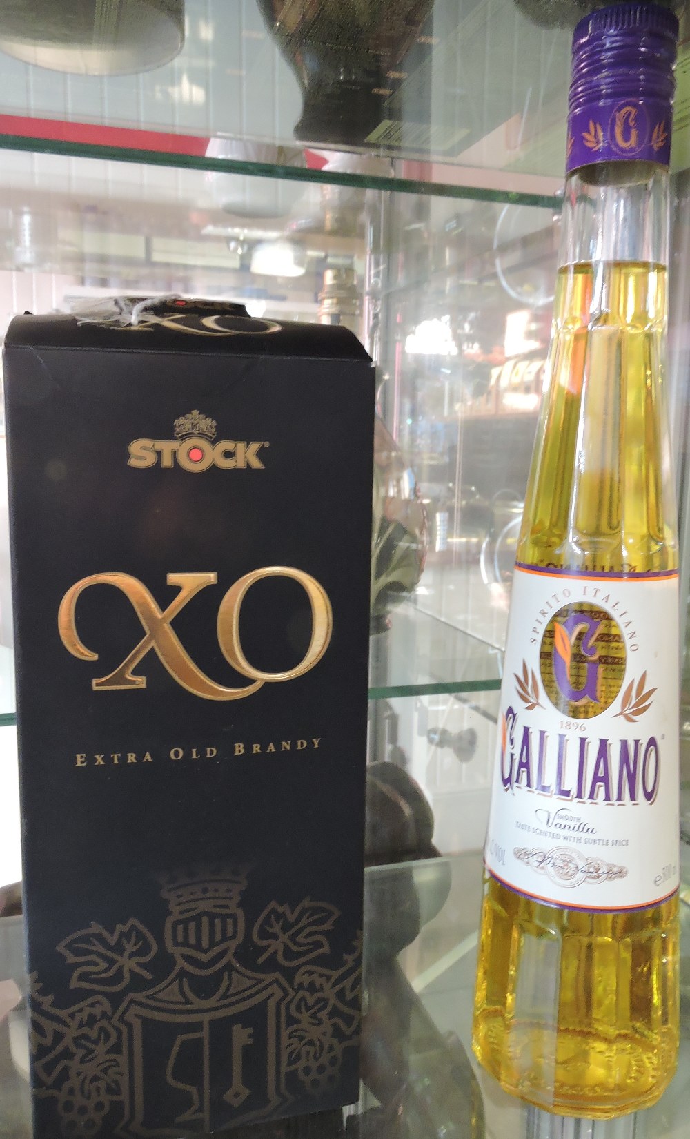 A bottle of Italian XO stock extra old brandy together with a bottle of Galliano vanilla liquor.