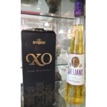 A bottle of Italian XO stock extra old brandy together with a bottle of Galliano vanilla liquor.