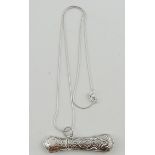 A Victorian style embossed silver needle case on fine chain.