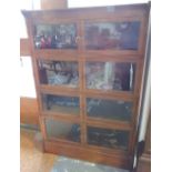 An early 20th Century 'Oxford' mahogany four section bookcase each tier enclosed by two glazed