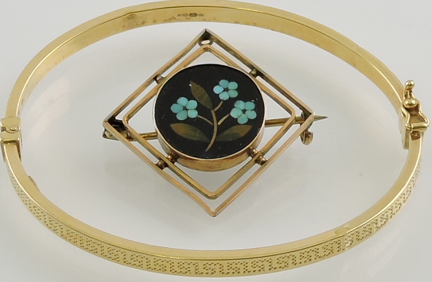 A 9ct yellow gold hollow hinged bangle together with a pietra dura brooch in yellow metal open