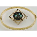 A 9ct yellow gold hollow hinged bangle together with a pietra dura brooch in yellow metal open