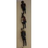 A set of three Austrian style composition coat hooks medelled as dog generals and hare gamekeeper,