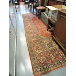 A Belgian Persian design red ground carpet, approx 12ft x 8ft.